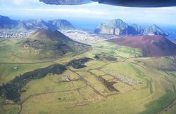 Helgafell (l) and Eldfell (r) today.  The line of the 1973 fissure south of Eldfell is clearly seen