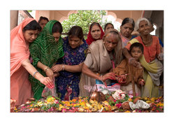 Women making offerings on the banks of the river Shipra, Ujjain