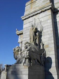 One of the four groups of statuary which mark the corners of the Shrine. Greek and Assyrian influences can be seen, but no Christian motifs. The four statuary groups representing Peace, Justice, Patriotism and Sacrifice were created by sculptor Paul Montford.