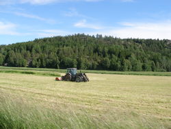 Farming the modern way using a tractor in Sweden.