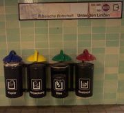 A recycling and rubbish bin in a Berlin public-transport station