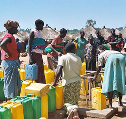 Women lining up to draw water from a borehole in Labuje camp, Kitgum.