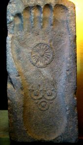 Footprint of the Buddha with the triratana, the symbolic depiction of the Three Jewels, and the Dharma wheel, 1st century CE, Gandhara.
