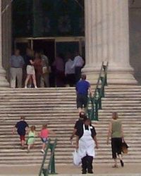 Social interactions of people and their consequences are the subject of sociology studies. Here we see people engaged in various actions on the stairs of the institution of Field Museum of Natural History in Chicago, Illinois.