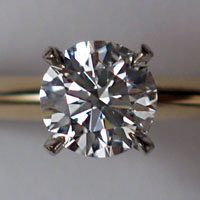 A round brilliant cut diamond set in a ring.