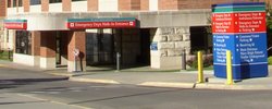 The emergency department entrance at Mayo Clinic's Saint Marys HospitalThe red-and-white emergency sign is very noticeable.