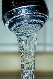 Drinking water from a tap