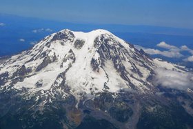 Massive Tahoma Glacier descends southwest from the summit ice cap flanked by Puyallup and South Tahoma Glaciers
