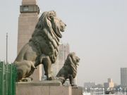 Lions guard the Kasr-el-Nil Bridge which traverses the Nile at Tahrir Square. European architecture and urban design, major infrastructural projects and intense cultural patronage were part of Khedive Ismail's vision for Cairo as "Paris on the Nile." 