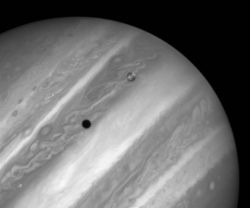 A picture of Jupiter and its moon Io taken by Hubble. The black spot is Io's shadow.