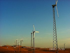 Some of the over 4000 wind turbines at Altamont Pass, in California. Developed during a period of tax incentives in the 1980s, this wind farm has more turbines than any other in the United States.  These kilowatt turbines cost several times more per kw/h and spin much more quickly than modern megawatt turbines, endangering birds and making noise. These units are likely Enertech E44-40kWs.