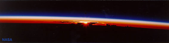 The sun rises through a convective cloud