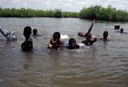 Children swimming near Lamin Lodge