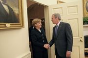 US President George W. Bush welcomes Chancellor Angela Merkel to the Oval Office 