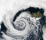 A large low pressure area swirls off the southwestern coast of Iceland. September 4, 2003