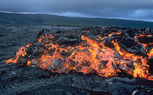 Glowing ʻaʻa flow front advancing over pāhoehoe on the coastal plain of Kīlauea in Hawaiʻi.
