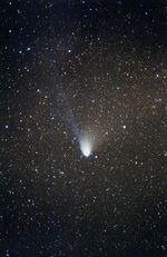Comet Hale-Bopp, showing a white dust tail and blue gas tail.  ESO, February 1997.