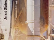 Camera D-67 captures grey smoke emitting from the right-hand SRB