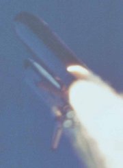 Camera E-207 captures plume near aft strut on right SRB