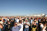 Many spectators turned out to see the flight, but found themselves looking into the sun.