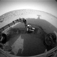 NASA's Mars Exploration Rover Spirit casts a shadow over the trench that the rover is examining with tools on its robotic arm. Spirit took this image with its front hazard-avoidance camera on February 21, 2004, during the rover's 48th martian day, or sol.