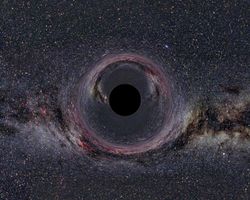 A (simulated) Black Hole of ten solar masses as seen from a distance of 600km with the Milky Way in the background (horizontal camera opening angle: 90&deg;).