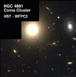 The giant elliptical galaxy NGC 4881 (the spherical glow at upper left) lies at the edge of the Coma Cluster of Galaxies.