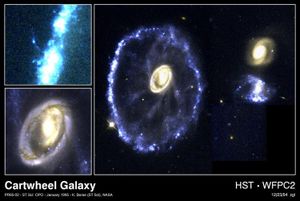 A spectacular head-on collision between two galaxies is seen in this NASA Hubble Space Telescope true-colour image of the Cartwheel Galaxy.